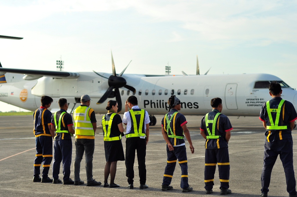 Philippine AIrlines turbo prop plane in Clark international airport.JPG